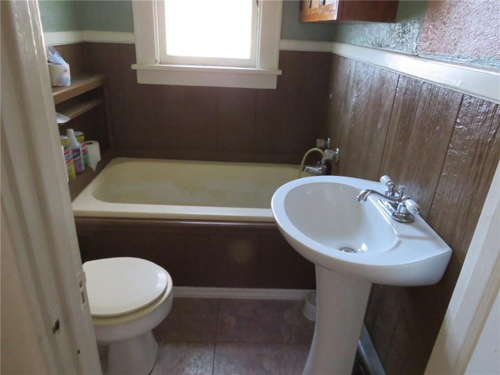 20 Beech Street Ambridge, PA 15003 - Photo 19 of 44 a bathroom with a sink a toilet and a mirror