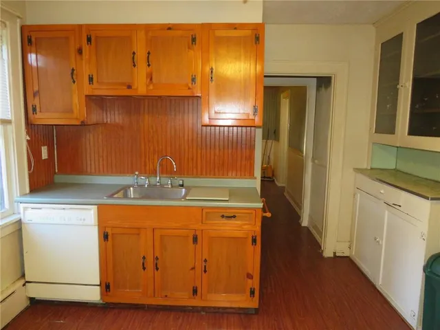 a kitchen with a stove and a refrigerator