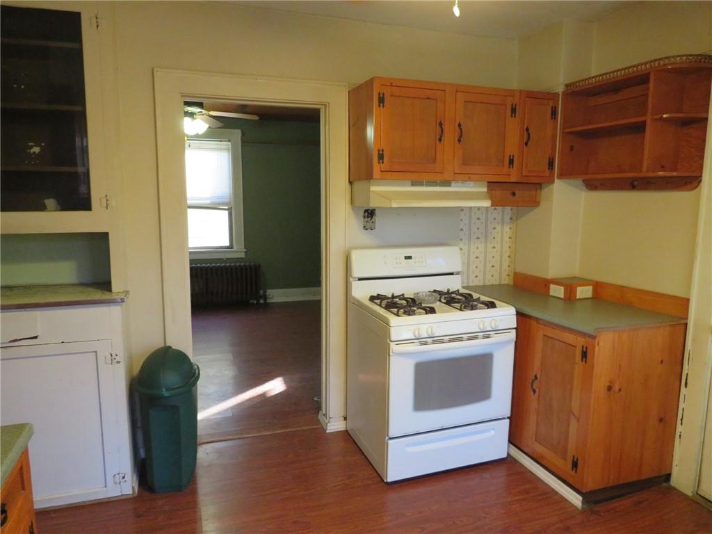 20 Beech Street Ambridge, PA 15003 - Photo 21 of 44 a kitchen with a stove and a refrigerator