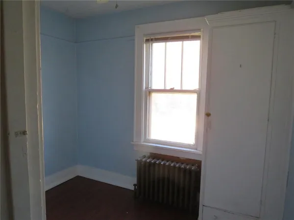 a view of front door with wooden floor