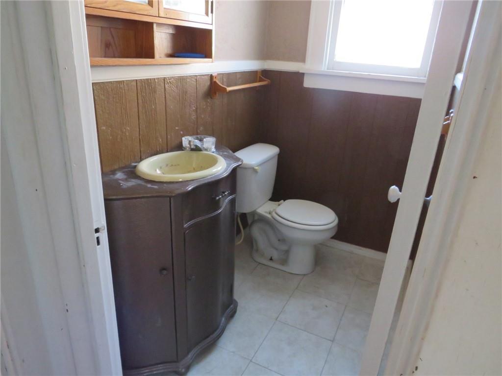 20 Beech Street Ambridge, PA 15003 - Photo 25 of 44 a bathroom with a sink toilet and a mirror