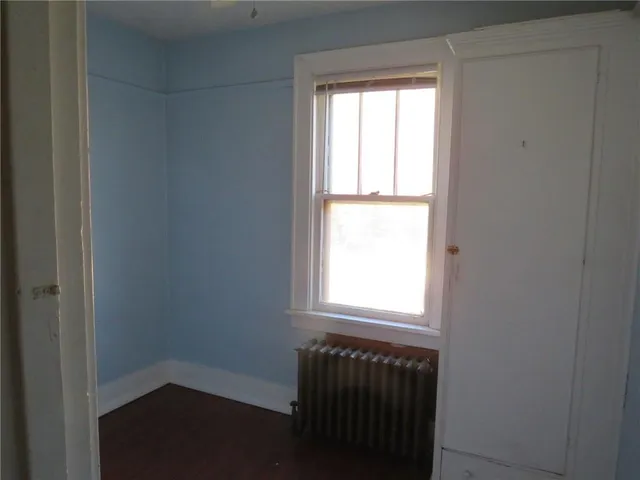 a view of front door with wooden floor