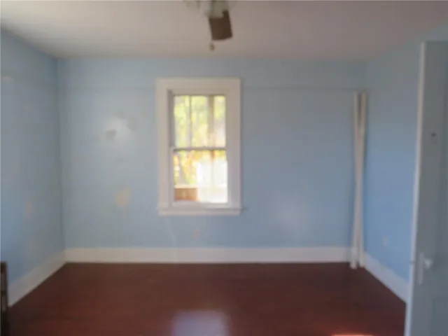 a bathroom with a glass door shower and a sink