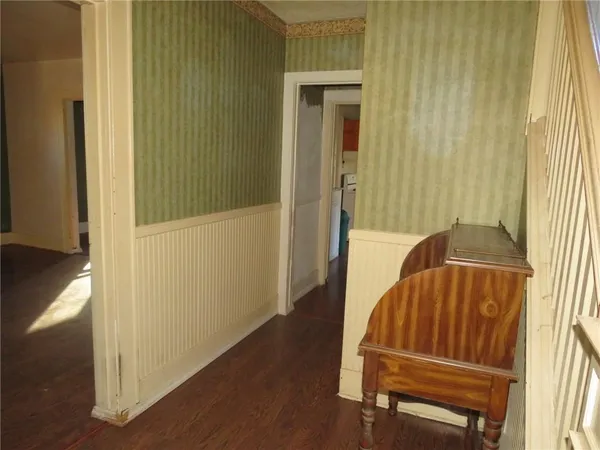 a view of front door with wooden floor