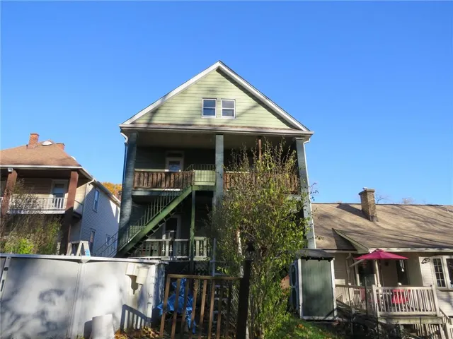 a front view of a house with a porch