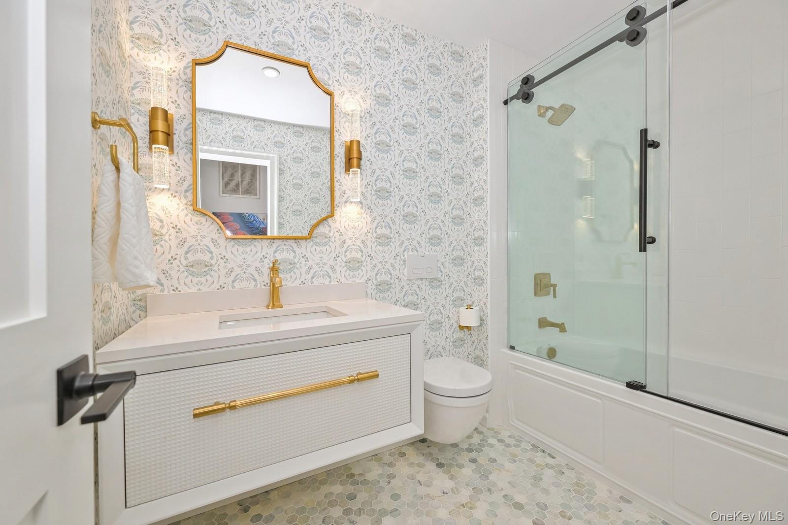 16 Hildreth Road Hampton Bays, NY 11946 - Photo 17 of 29 a bathroom with a sink a toilet and shower