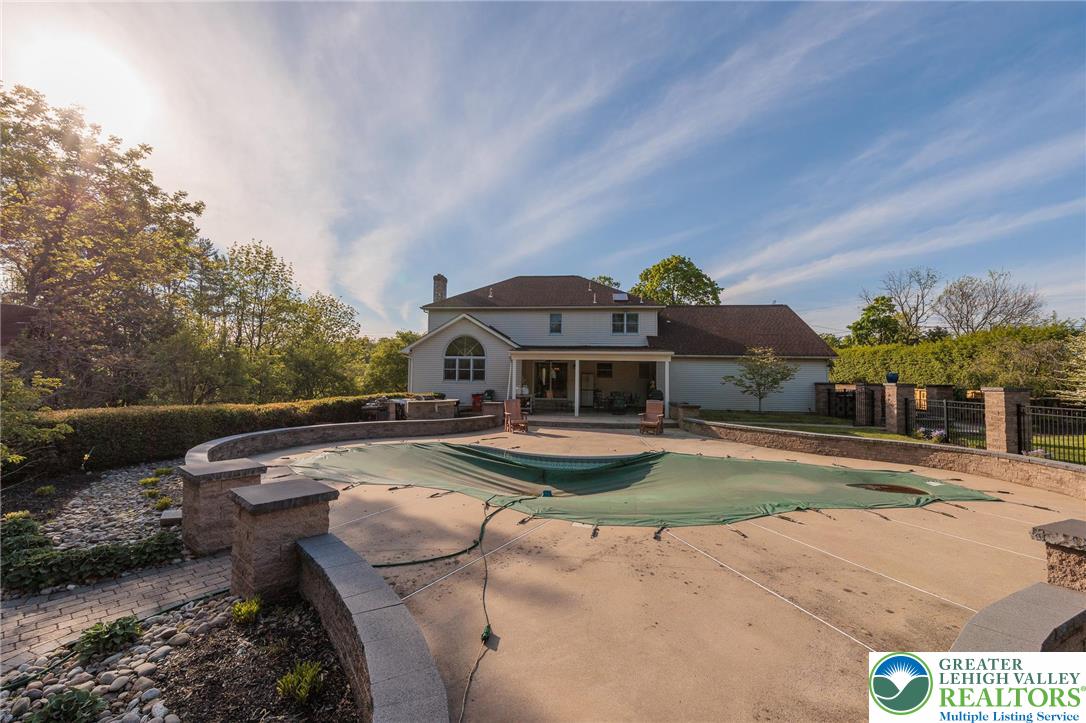 2170 Clearview Road Coplay, PA 18037 - Photo 67 of 75 This spacious backyard features a covered pool and ample patio space for outdoor enjoyment.