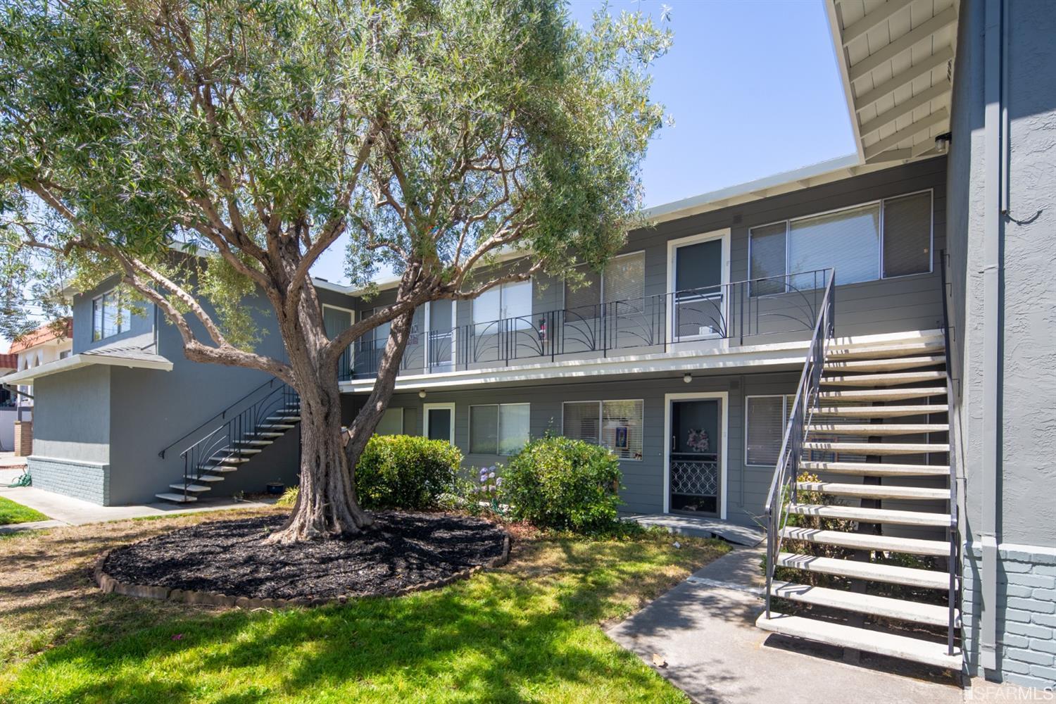 1455 Bay Street Alameda, CA 94501 - Photo 2 of 39 a front view of house with a garden