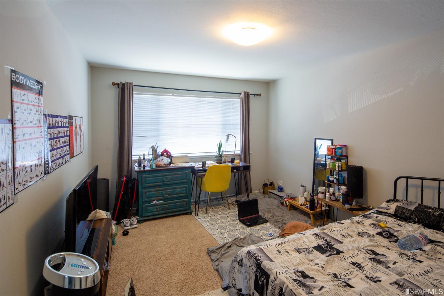 1455 Bay Street Alameda, CA 94501 - Photo 18 of 39 a bed room with a bed a desk and flowerpot