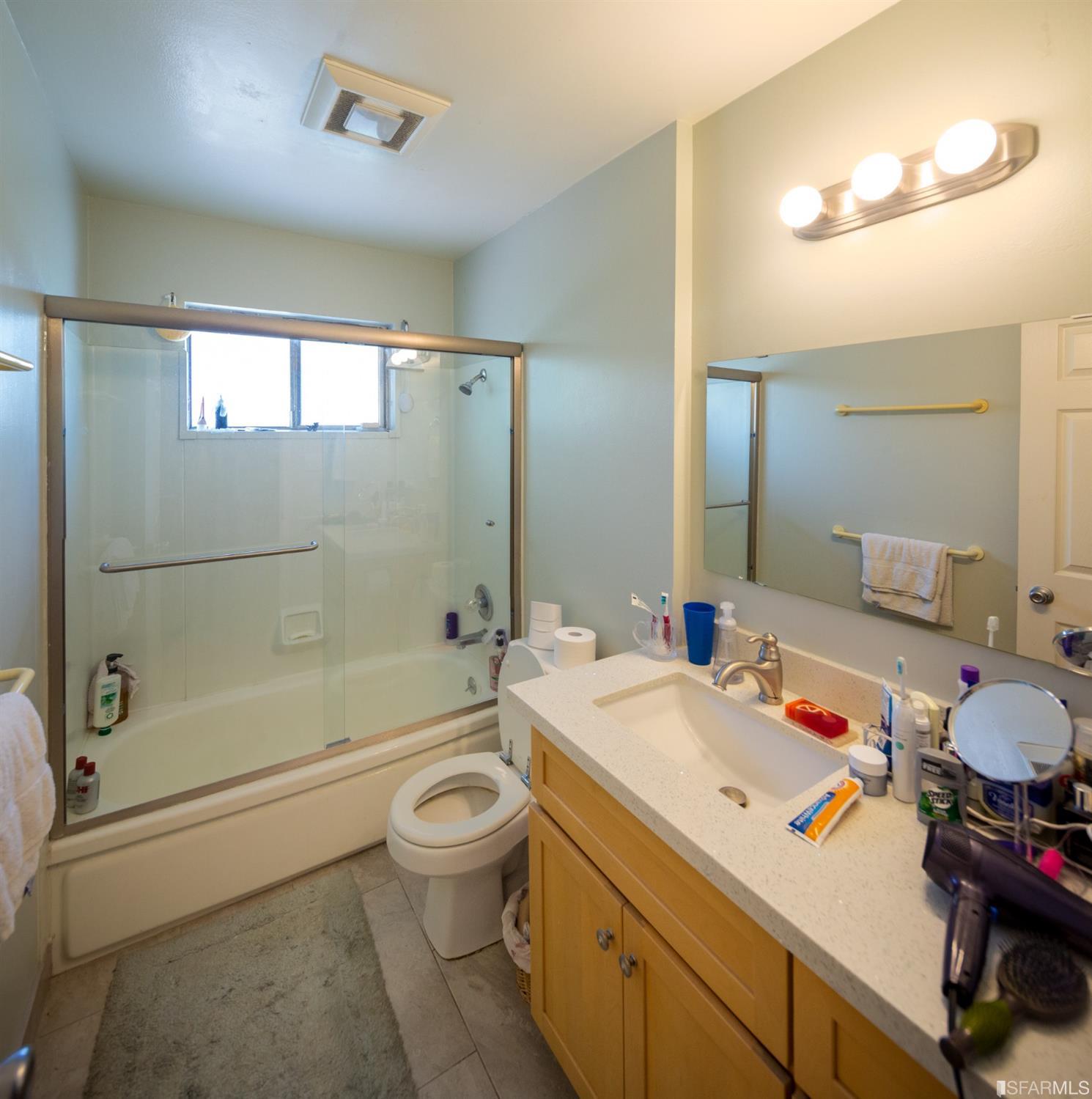 1455 Bay Street Alameda, CA 94501 - Photo 19 of 39 a bathroom with a sink a toilet and a bathtub