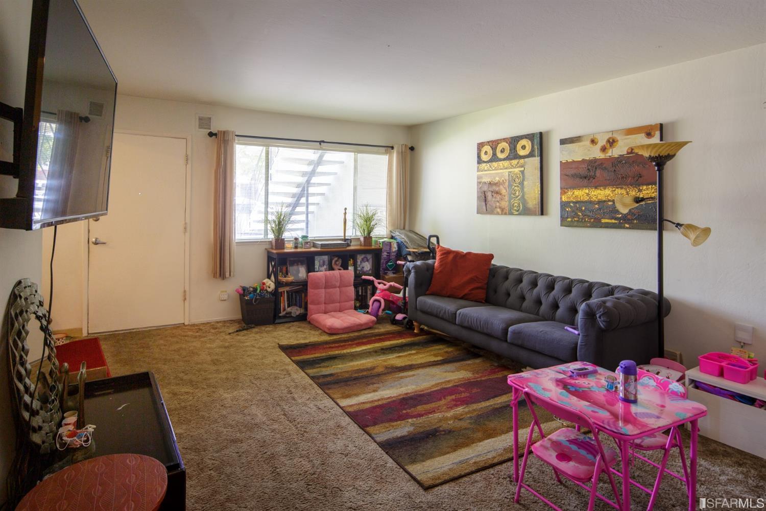 1455 Bay Street Alameda, CA 94501 - Photo 20 of 39 a living room with furniture and a window