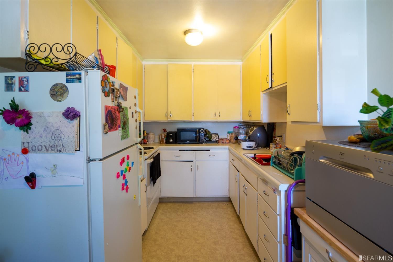 1455 Bay Street Alameda, CA 94501 - Photo 21 of 39 a kitchen with refrigerator and stove