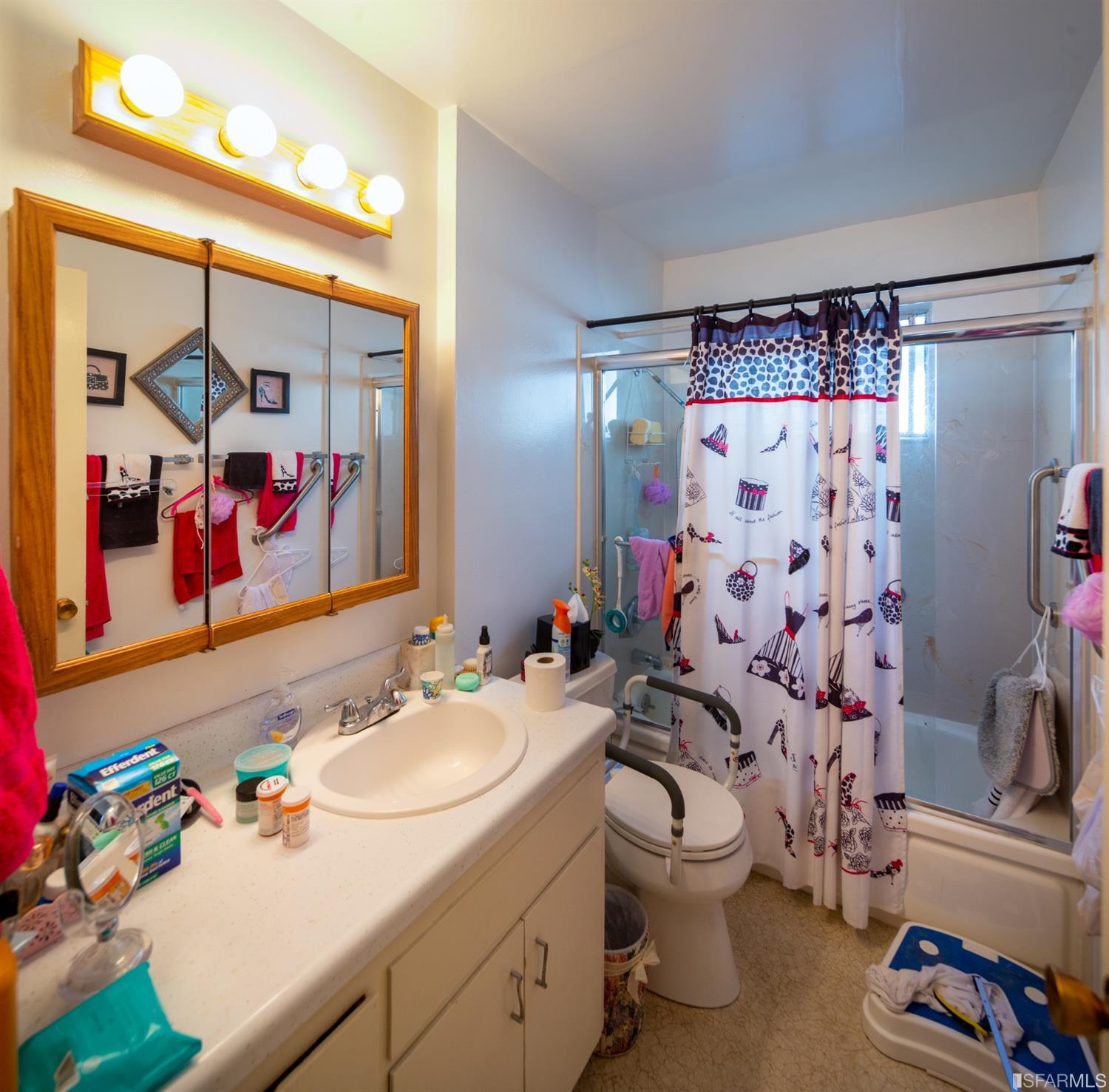 1455 Bay Street Alameda, CA 94501 - Photo 22 of 39 a bathroom with a sink toilet and shower