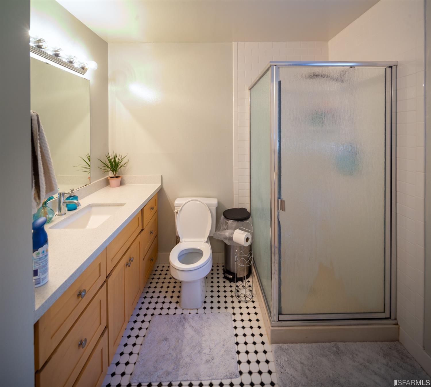 1455 Bay Street Alameda, CA 94501 - Photo 25 of 39 a bathroom with a sink toilet and shower