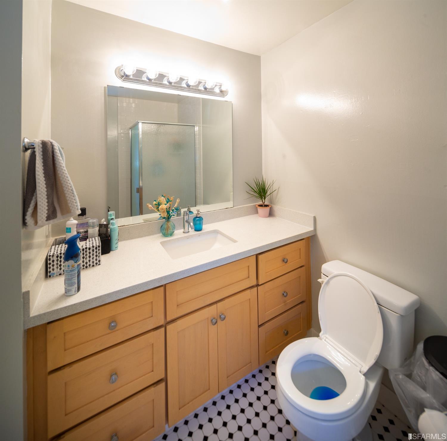 1455 Bay Street Alameda, CA 94501 - Photo 26 of 39 a bathroom with a toilet a sink and mirror