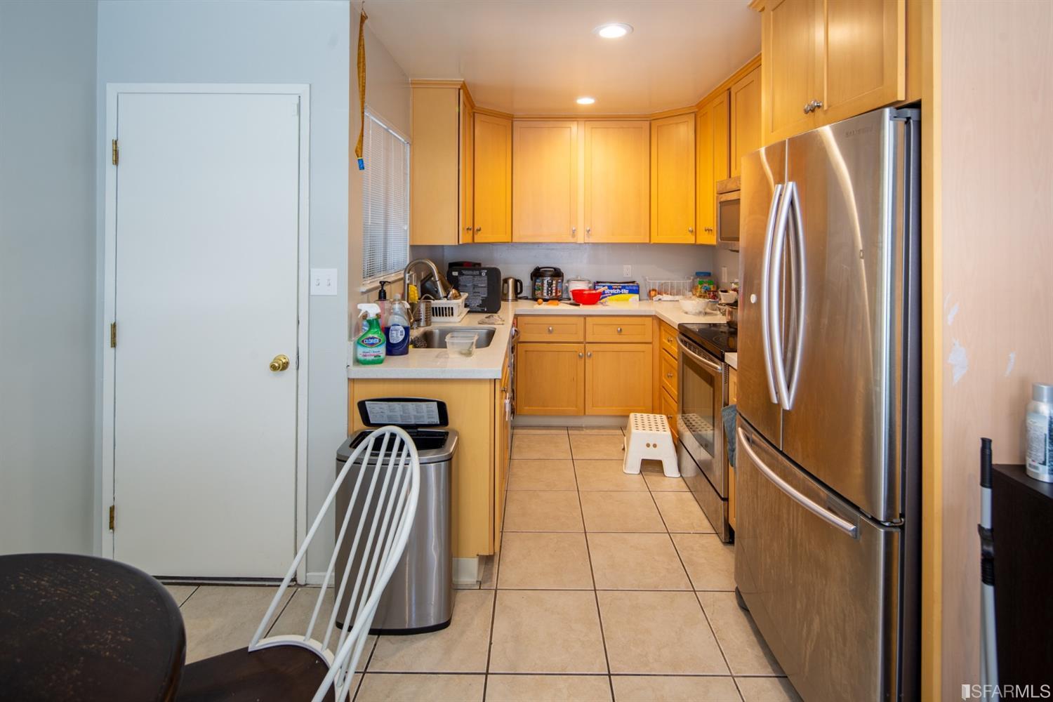 1455 Bay Street Alameda, CA 94501 - Photo 28 of 39 a kitchen with stainless steel appliances granite countertop a refrigerator and a sink