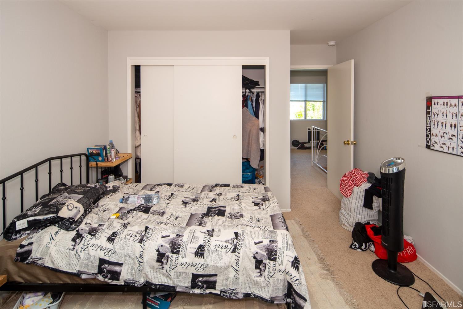 1455 Bay Street Alameda, CA 94501 - Photo 30 of 39 a bedroom with bed and wooden floor