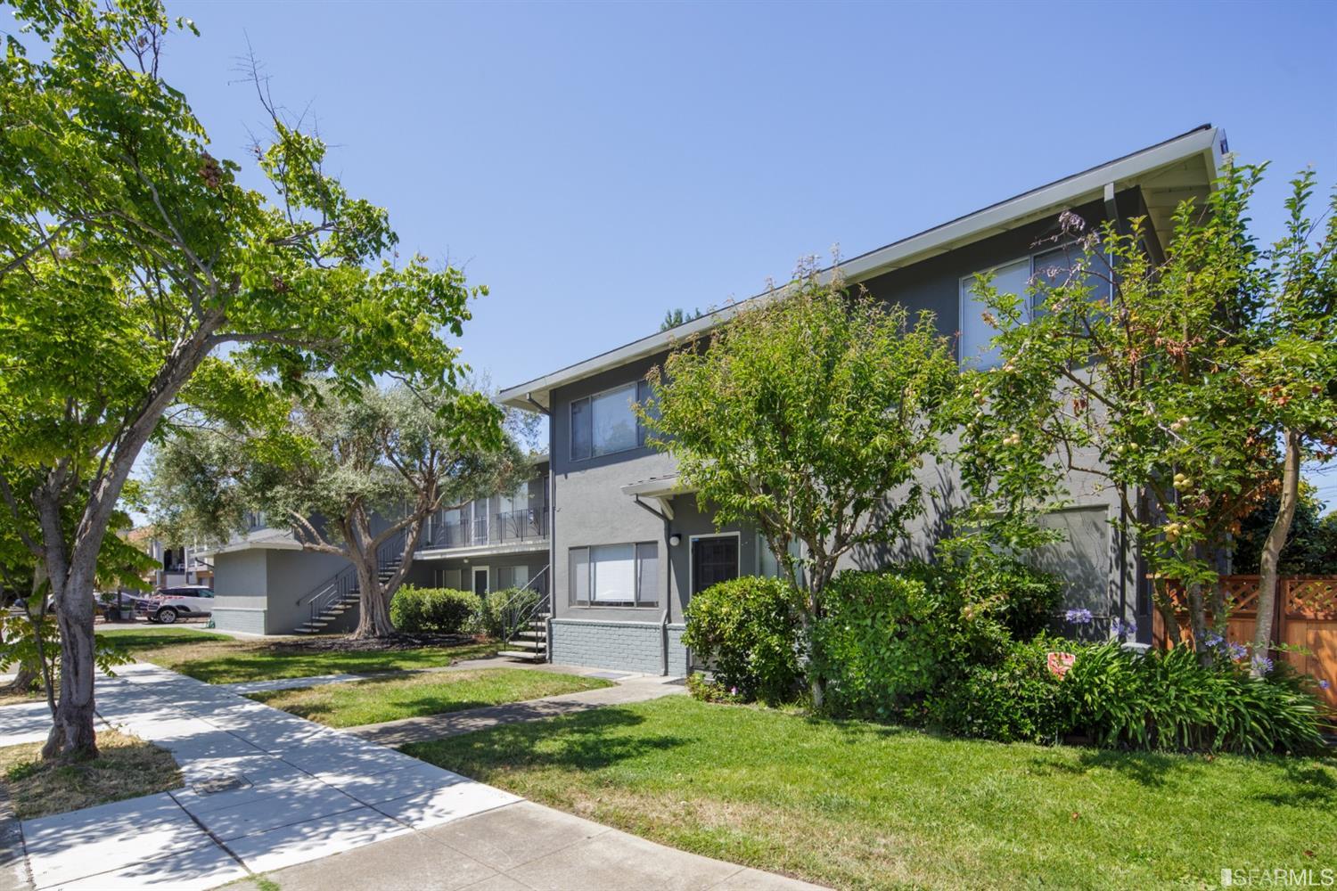 1455 Bay Street Alameda, CA 94501 - Photo 4 of 39 a front view of a house with a yard