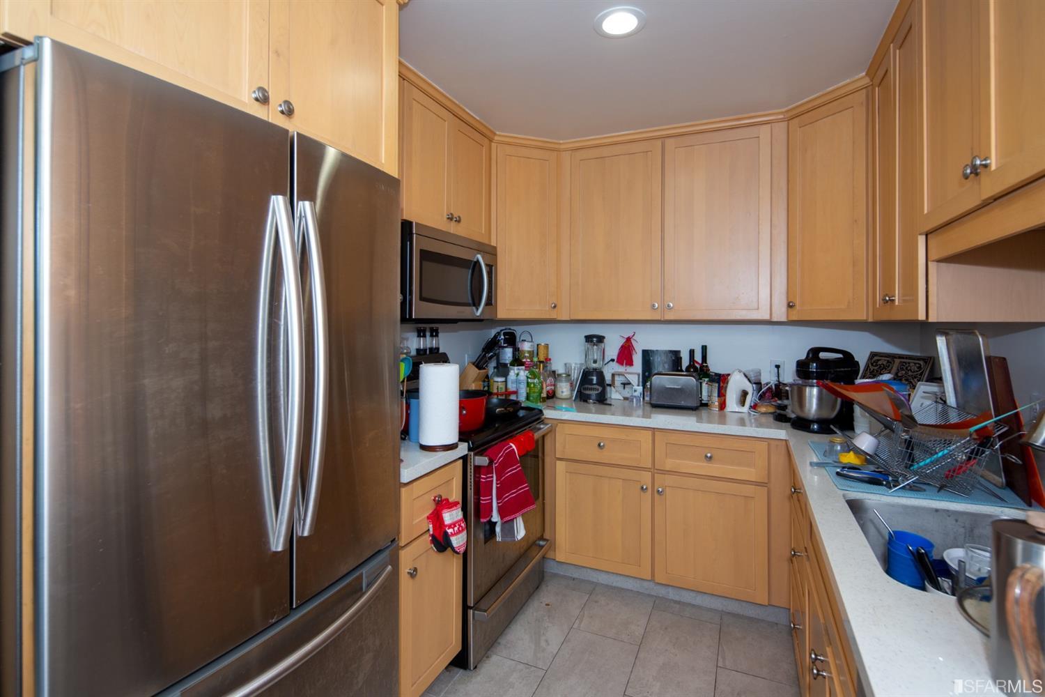 1455 Bay Street Alameda, CA 94501 - Photo 33 of 39 a kitchen with stainless steel appliances granite countertop a refrigerator and a sink