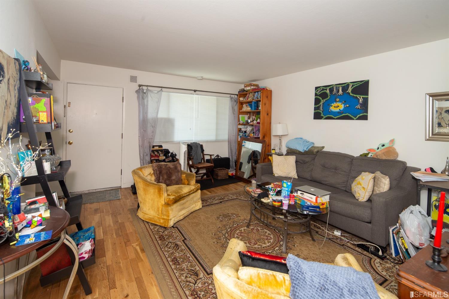 1455 Bay Street Alameda, CA 94501 - Photo 34 of 39 a living room with furniture a flat screen tv and a window