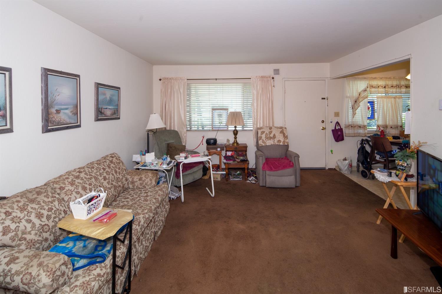 1455 Bay Street Alameda, CA 94501 - Photo 37 of 39 a living room with furniture and a wooden floor
