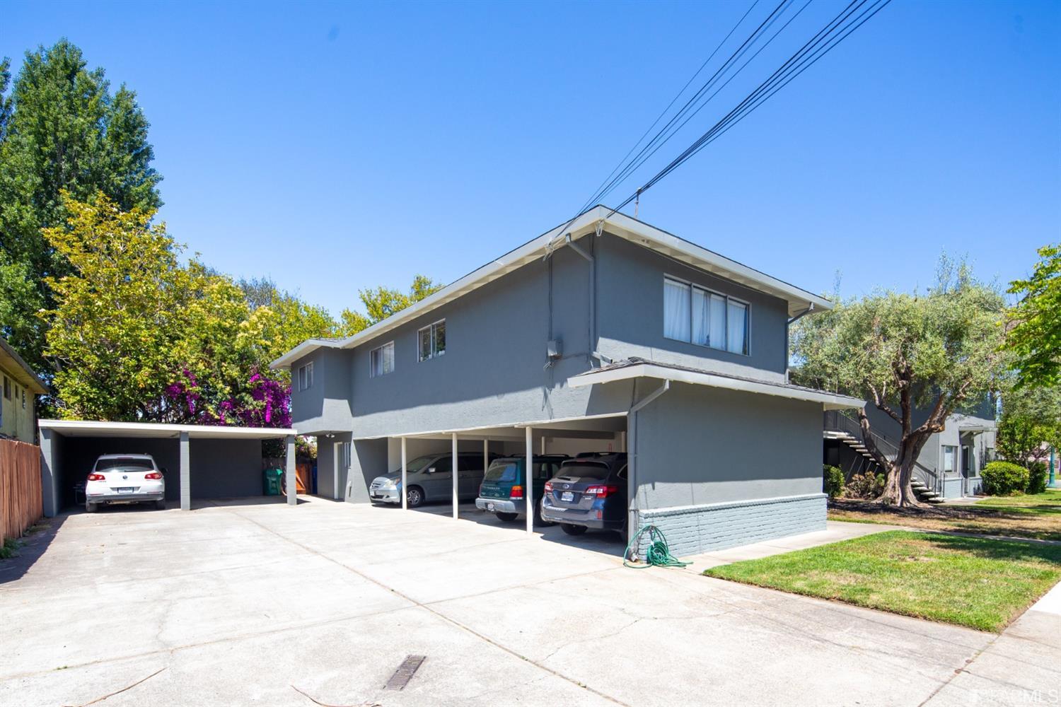1455 Bay Street Alameda, CA 94501 - Photo 5 of 39 a front view of a house with a garage