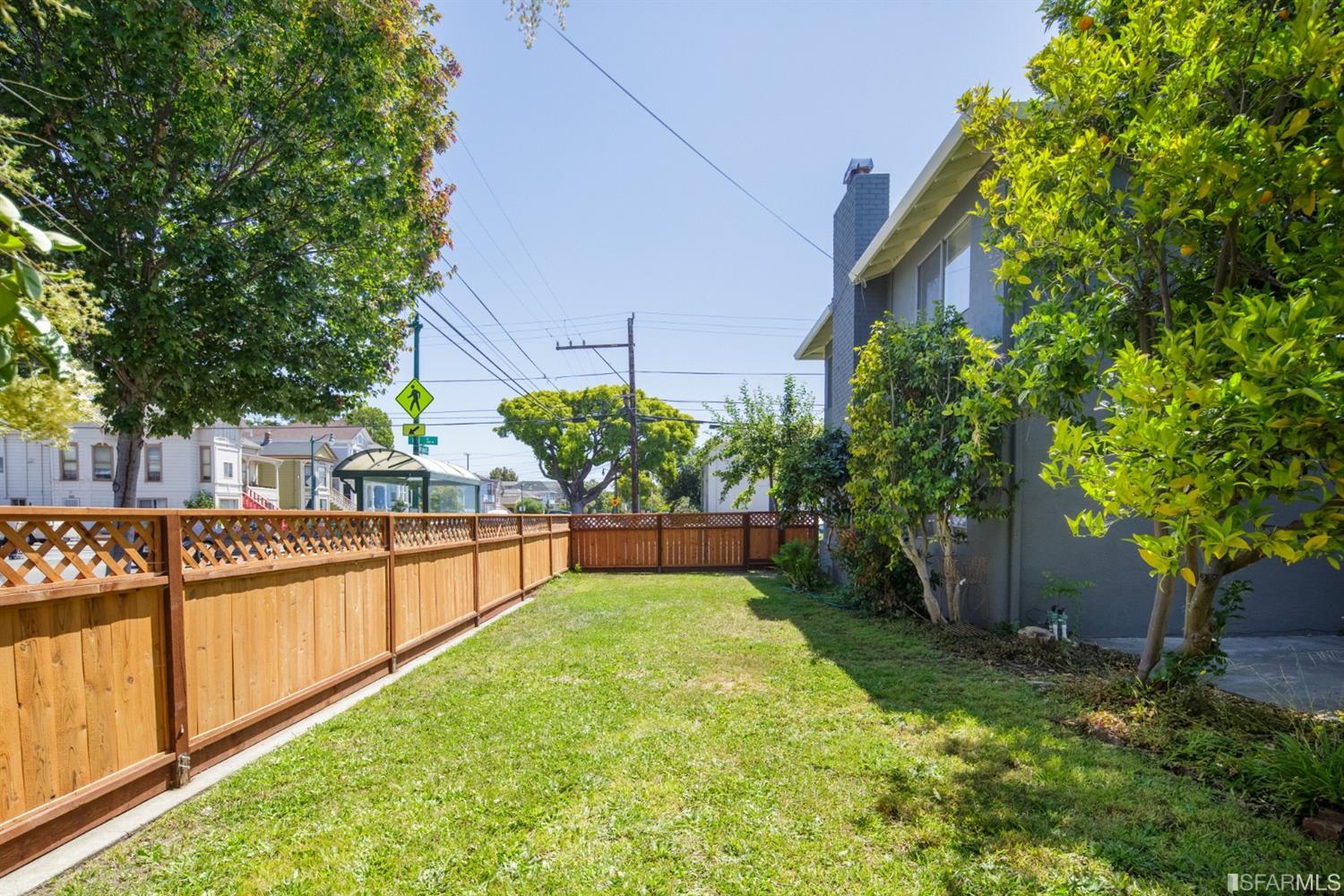 1455 Bay Street Alameda, CA 94501 - Photo 7 of 39 a view of a garden with large trees