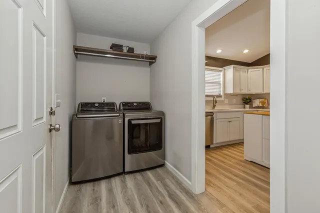 a kitchen with a sink stainless steel appliances and cabinets