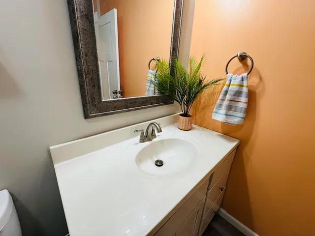 a view of a livingroom with a chandelier fan