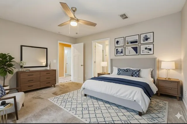 a bathroom with a granite countertop sink mirror and vanity