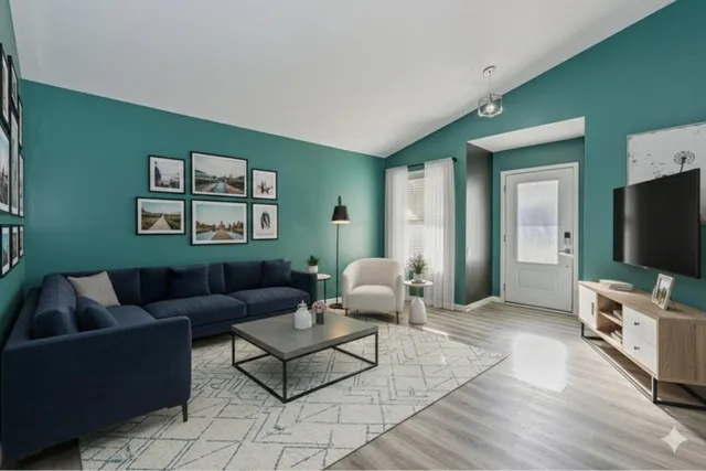 a living room with furniture and a flat screen tv