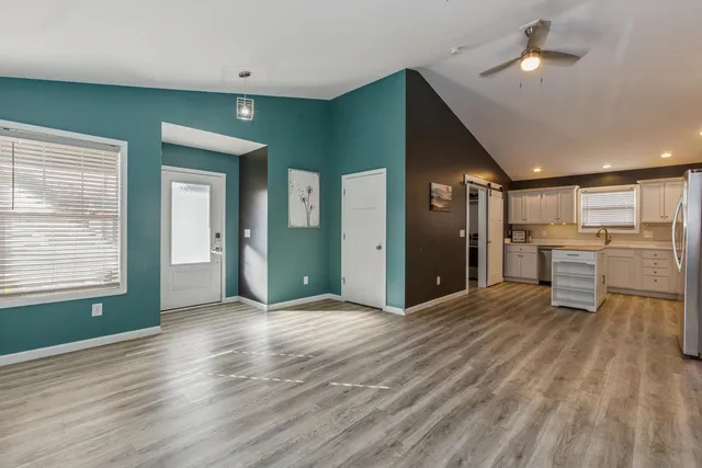a view of a livingroom with a kitchen