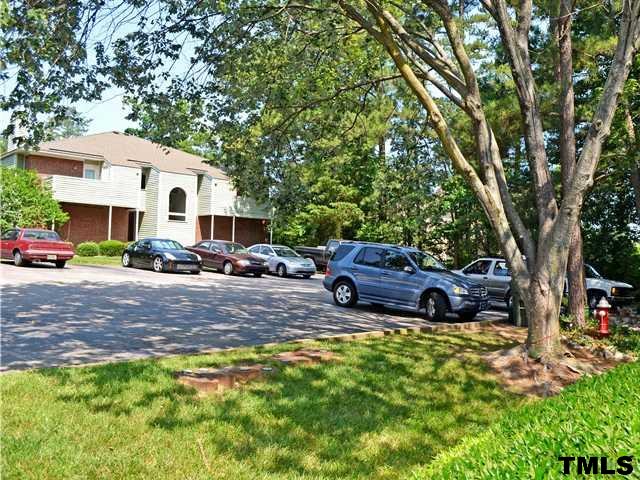 3625 Mill Run, Unit 5 Raleigh, NC 27612 - Photo 22 of 22 a view of a house with a yard