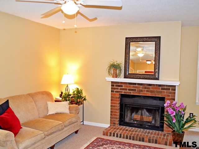 3625 Mill Run, Unit 5 Raleigh, NC 27612 - Photo 4 of 22 a living room with furniture and a fireplace