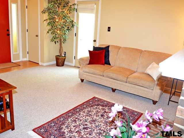 3625 Mill Run, Unit 5 Raleigh, NC 27612 - Photo 5 of 22 a living room with furniture and a potted plant