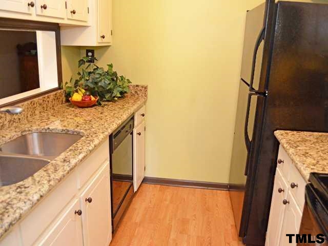 3625 Mill Run, Unit 5 Raleigh, NC 27612 - Photo 7 of 22 a view of a kitchen cabinets and a counter place