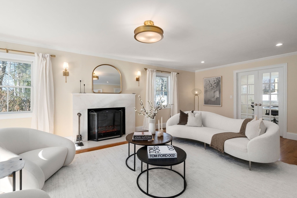 150 Country Club Road Newton, MA 02459 - Photo 2 of 33 a living room with furniture a fireplace and window
