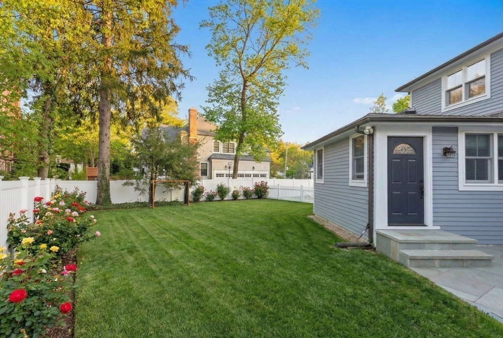 150 Country Club Road Newton, MA 02459 - Photo 26 of 33 a view of a house with garden