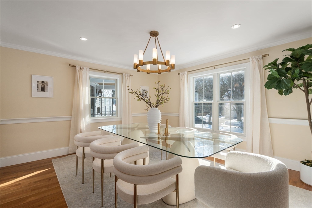 150 Country Club Road Newton, MA 02459 - Photo 10 of 33 a dining room with chandelier and wooden floor