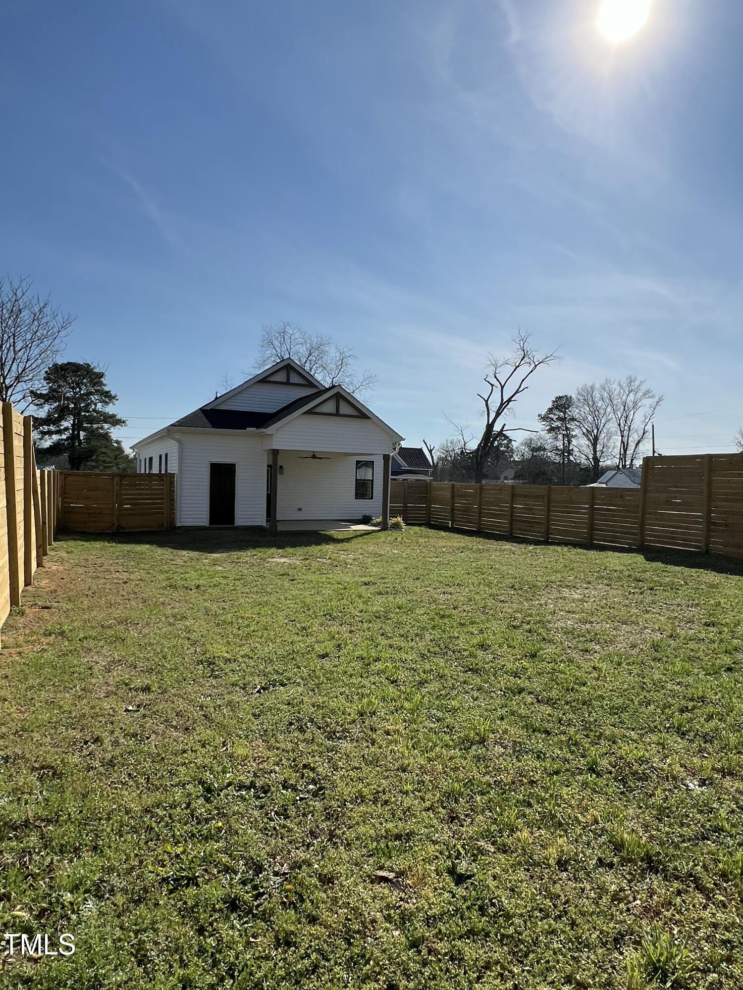 151 East Washington Street Coats, NC 27521 - Photo 40 of 44 a front view of a house with a yard