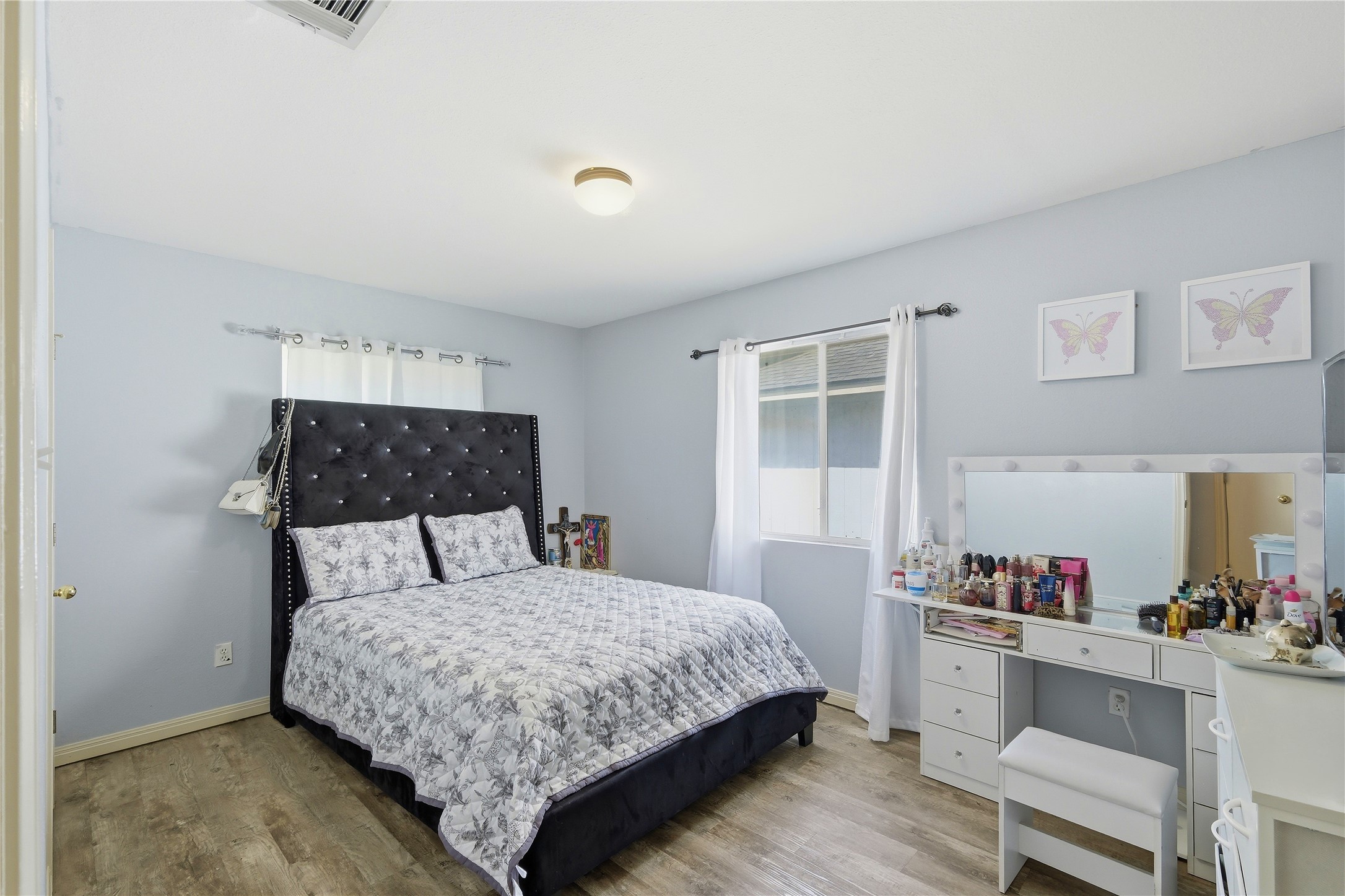 310 Raintree Drive Georgetown, TX 78626 - Photo 8 of 12 Natural light illuminates this bedroom, offering a serene and comfortable living space.