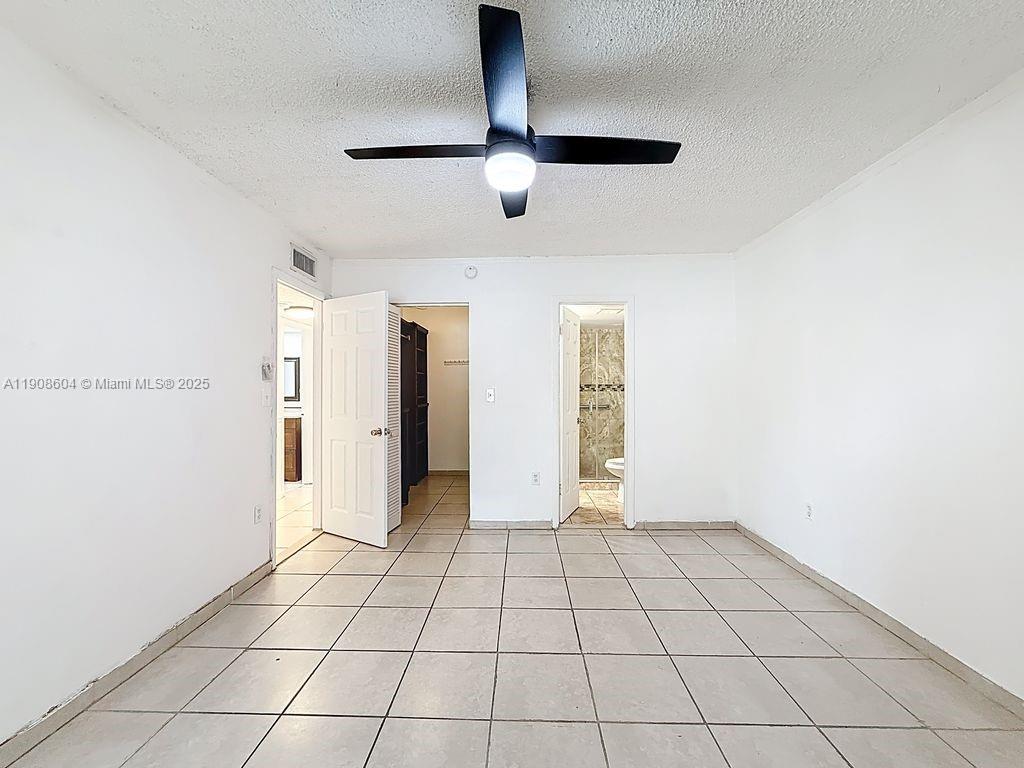 17600 Northwest 68th Avenue, Unit B2004 Hialeah, FL 33015 - Photo 11 of 24 a view of an empty room and window
