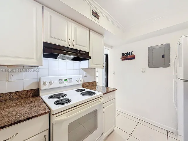 a view of a building with a yard