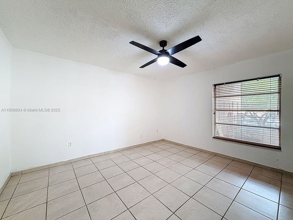 17600 Northwest 68th Avenue, Unit B2004 Hialeah, FL 33015 - Photo 16 of 24 a view of an empty room and window