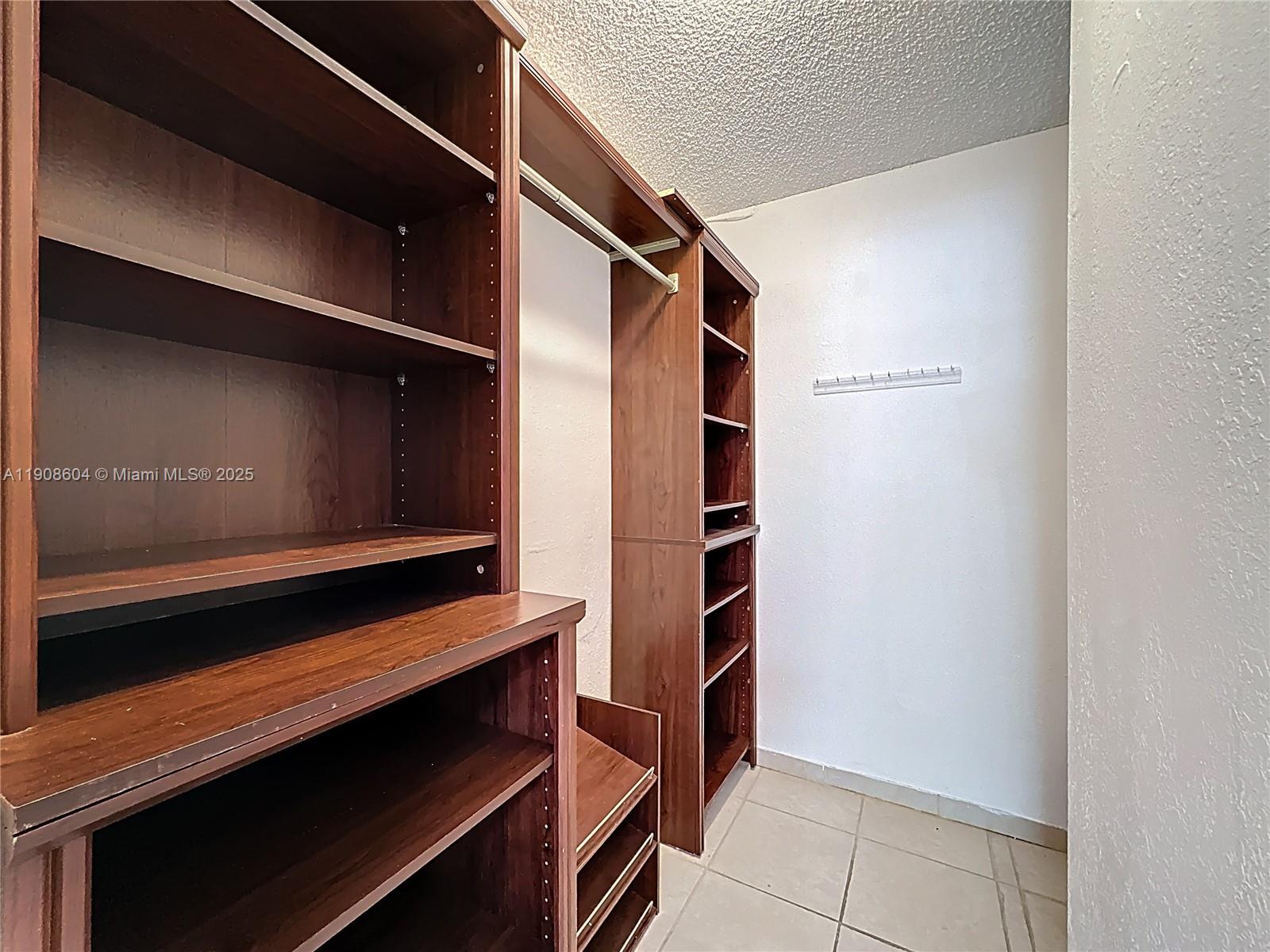 17600 Northwest 68th Avenue, Unit B2004 Hialeah, FL 33015 - Photo 6 of 24 a view of walk in closet
