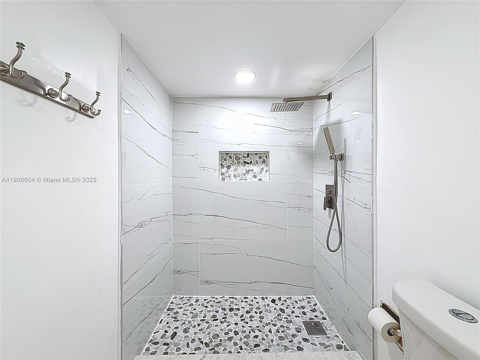 17600 Northwest 68th Avenue, Unit B2004 Hialeah, FL 33015 - Photo 7 of 24 a bathroom with a shower