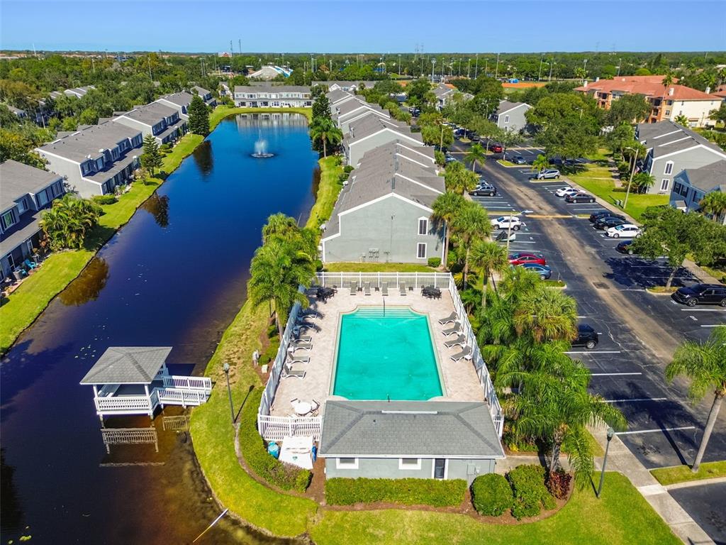 382 Countryside Key Boulevard Oldsmar, FL 34677 - Photo 48 of 58 an aerial view of a house with a garden and swimming pool