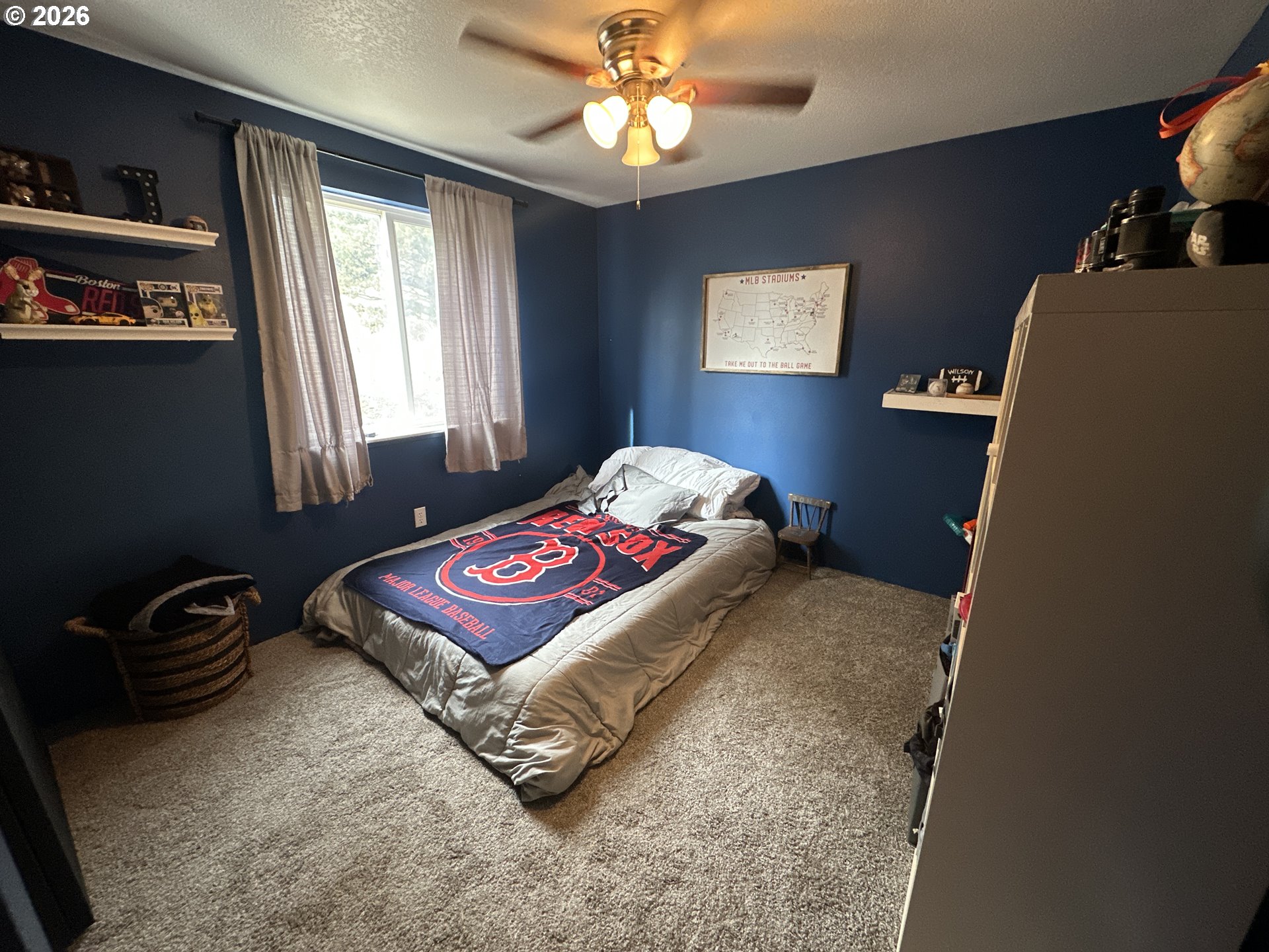 120 Valley View Drive John Day, OR 97845 - Photo 22 of 34 a bedroom with a bed and a chandelier