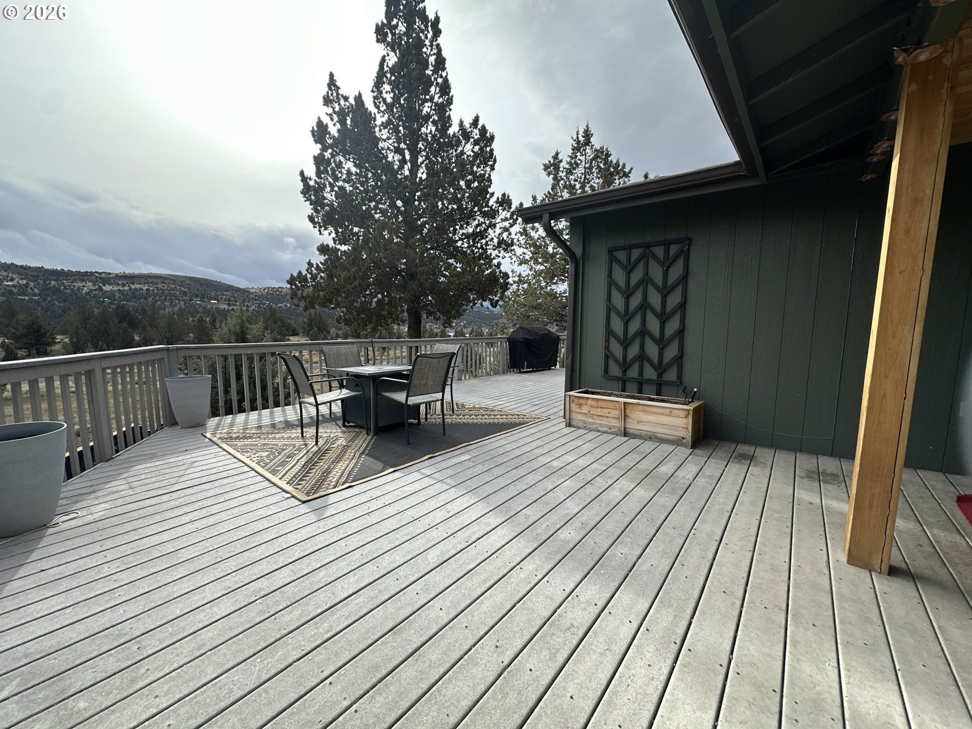 120 Valley View Drive John Day, OR 97845 - Photo 27 of 34 a view of a roof deck with wooden floor and fence