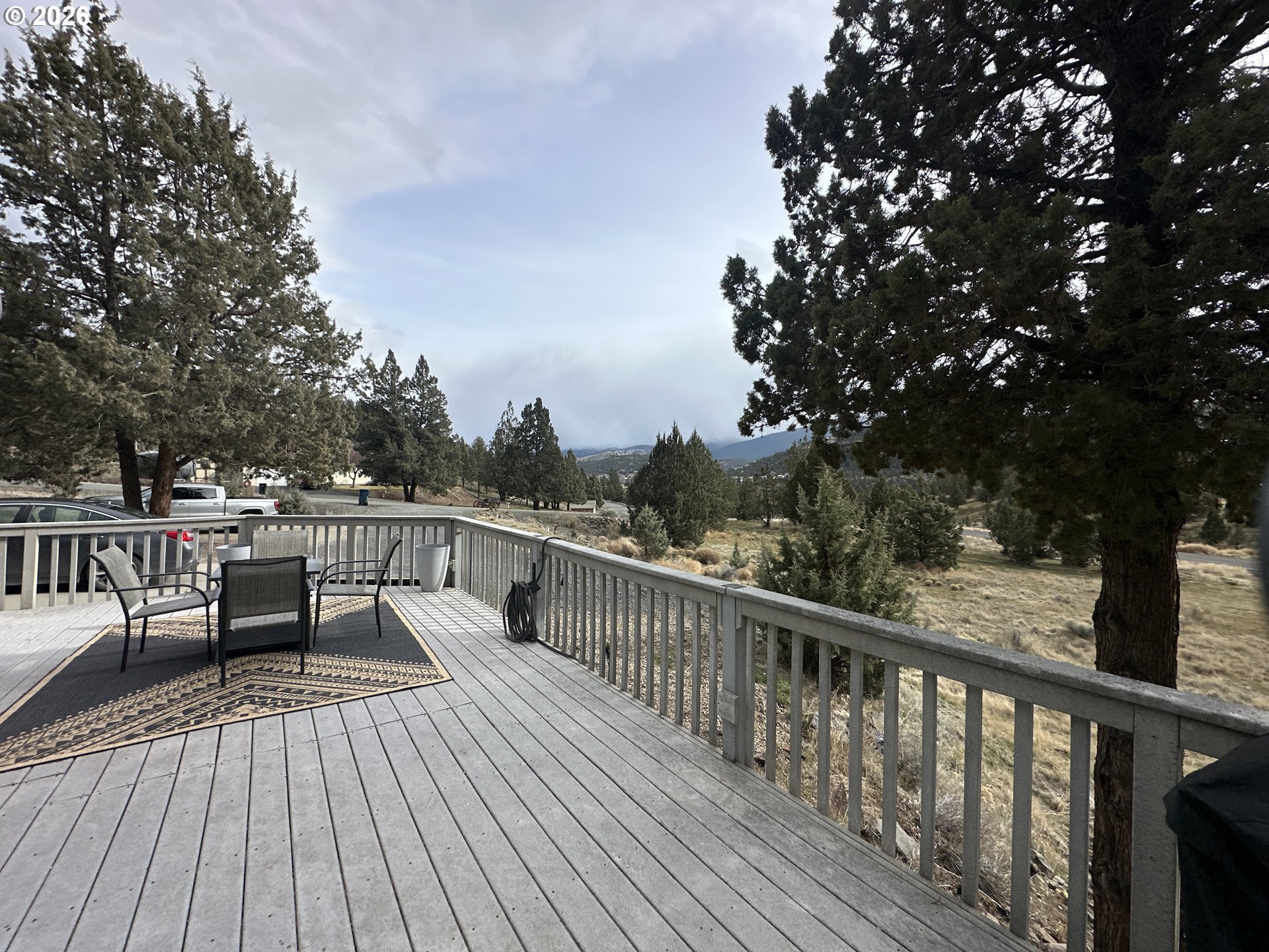 120 Valley View Drive John Day, OR 97845 - Photo 3 of 34 a view of roof deck with wooden floor and fence